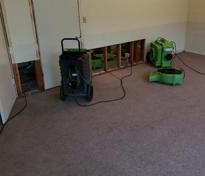 Air mover and dehumidifier in commercial building.